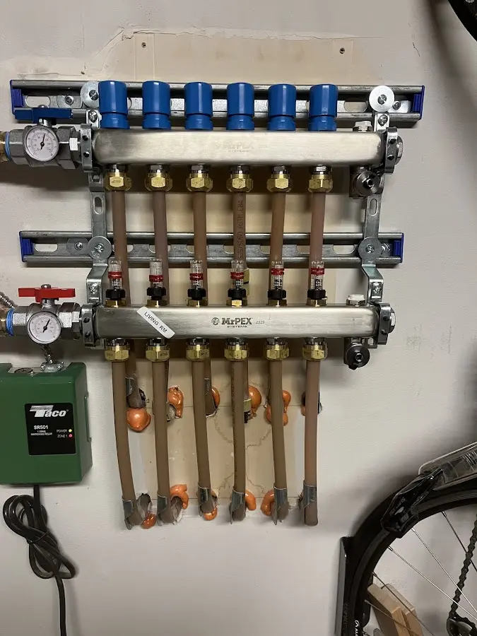 Plumber performing Gas Line Installation at a residential property in South Burlington